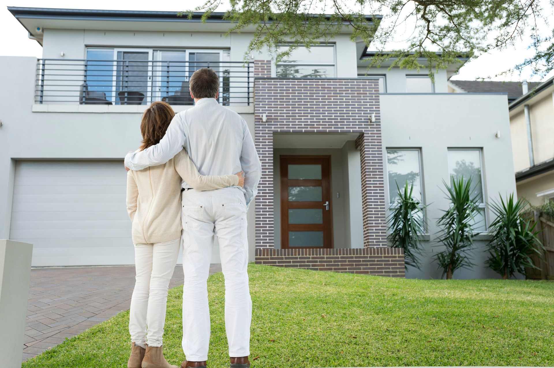 Mature couple looking at a house