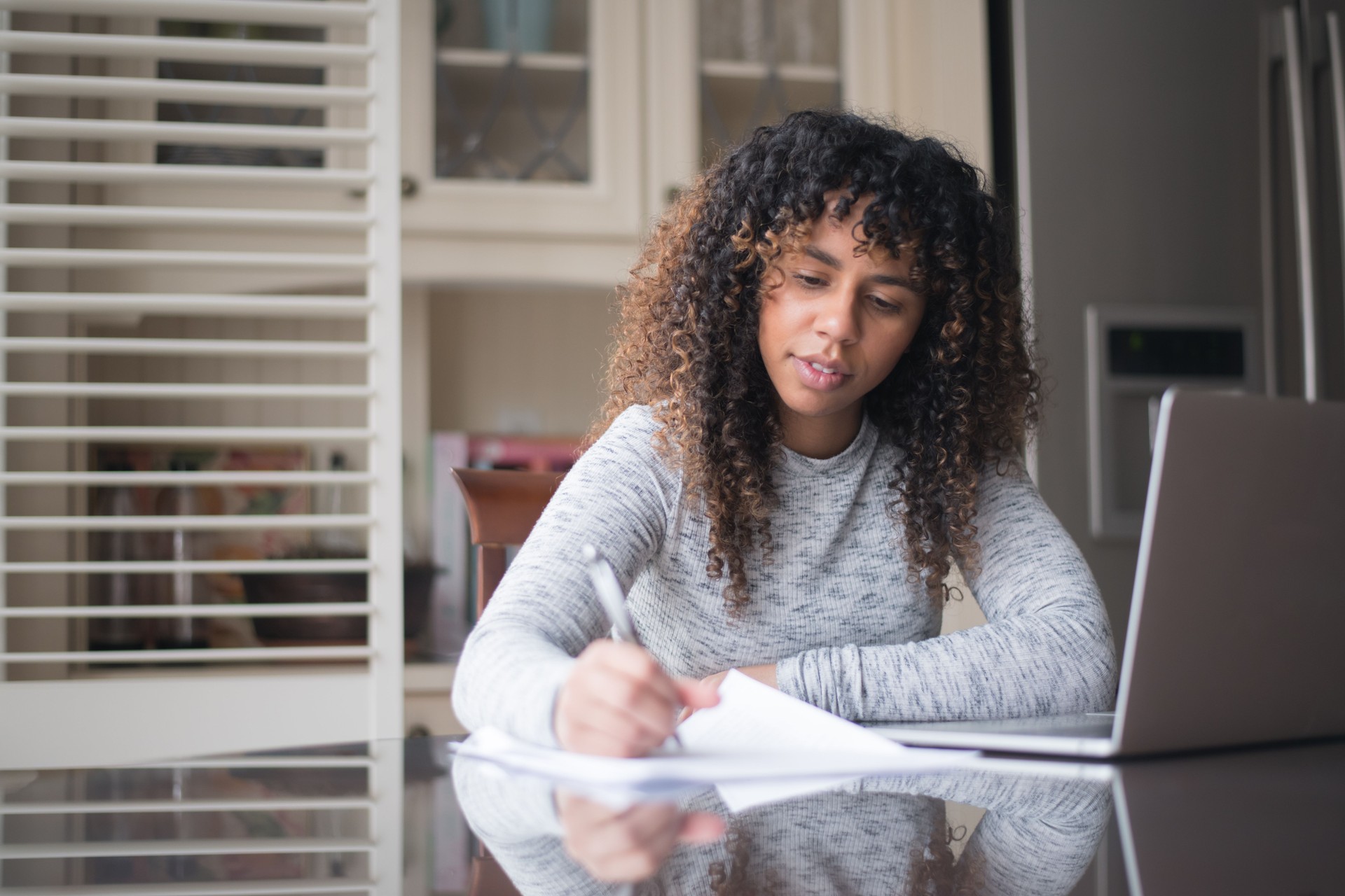 Woman of African Descent Filling Out Tax Forms