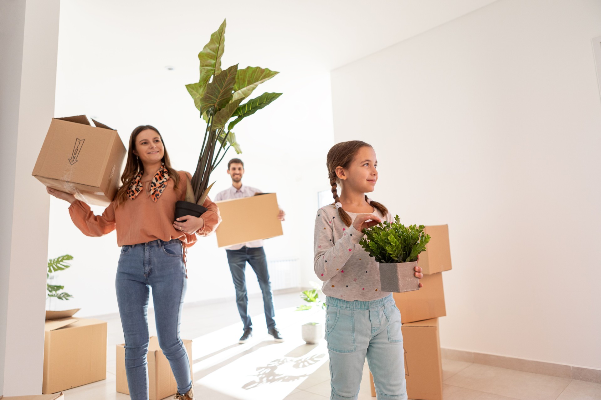 Young couple with daughter moving to their new home